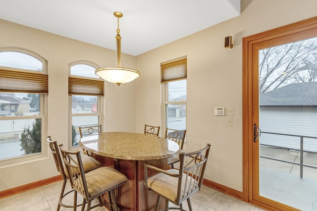 5301 S Mobile Ave, Chicago, IL 60638 - dining space with light tile patterned floors and baseboards
