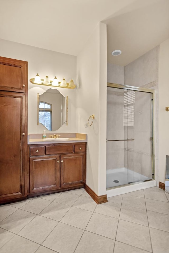 5301 S Mobile Ave, Chicago, IL 60638 - full bathroom with tile patterned flooring, a stall shower, baseboards, and vanity