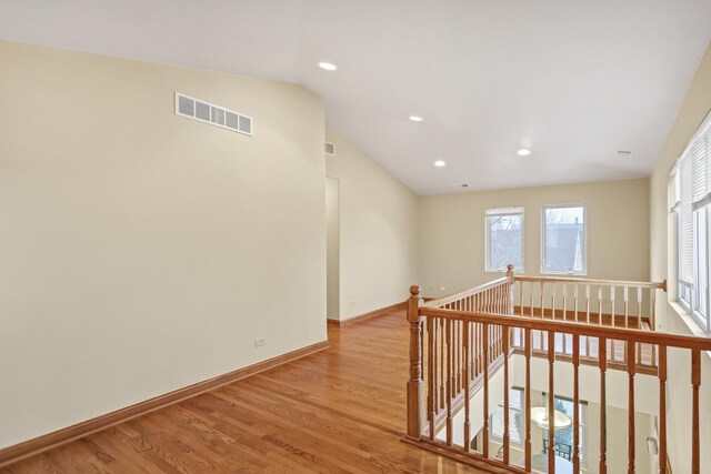 5301 S Mobile Ave, Chicago, IL 60638 - corridor featuring an upstairs landing, vaulted ceiling, wood finished floors, recessed lighting, and baseboards