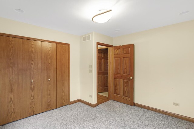 5301 S Mobile Ave, Chicago, IL 60638 - unfurnished bedroom with baseboards, carpet, and a closet
