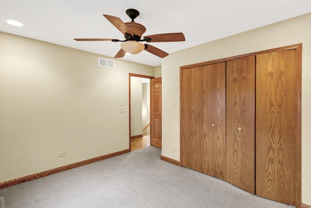 5301 S Mobile Ave, Chicago, IL 60638 - unfurnished bedroom featuring light colored carpet, a closet, baseboards, and ceiling fan