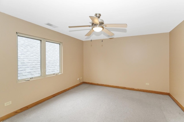 5301 S Mobile Ave, Chicago, IL 60638 - empty room featuring light carpet, baseboards, and ceiling fan