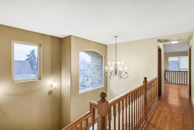 5301 S Mobile Ave, Chicago, IL 60638 - hall featuring an upstairs landing, wood finished floors, and a chandelier