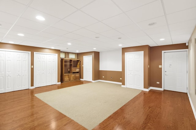 5301 S Mobile Ave, Chicago, IL 60638 - unfurnished living room featuring wood finished floors, baseboards, a paneled ceiling, and recessed lighting