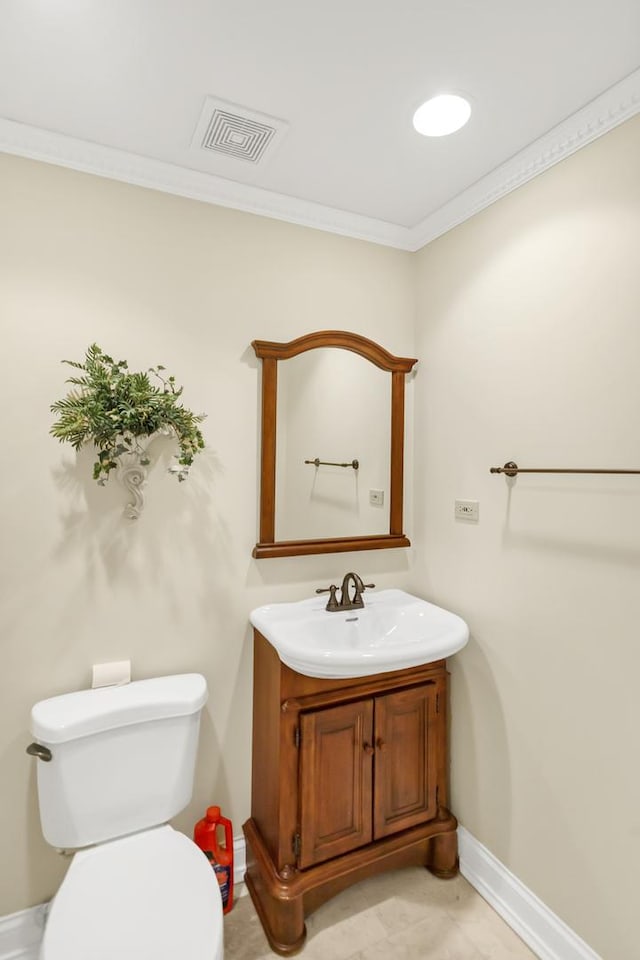 5301 S Mobile Ave, Chicago, IL 60638 - bathroom with crown molding, baseboards, toilet, and vanity
