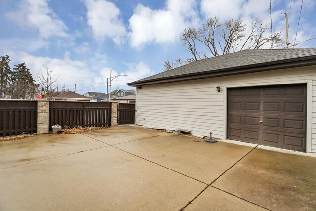 5301 S Mobile Ave, Chicago, IL 60638 - garage with concrete driveway and fence