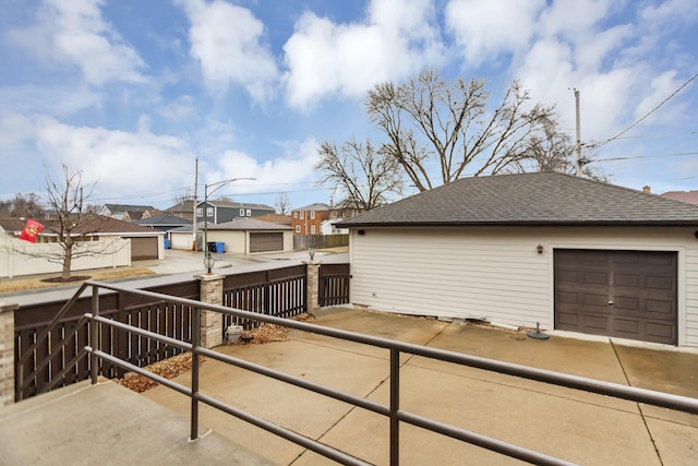 5301 S Mobile Ave, Chicago, IL 60638 - view of side of home with a residential view, a shingled roof, fence, and an outdoor structure