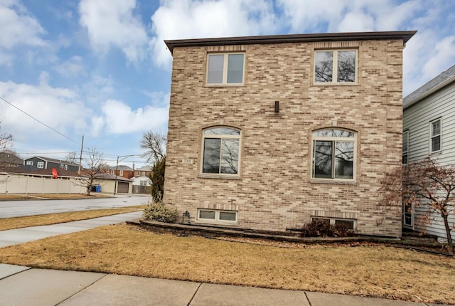5301 S Mobile Ave, Chicago, IL 60638 - view of home's exterior featuring brick siding and a yard