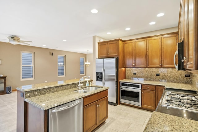 5301 S Mobile Ave, Chicago, IL 60638 - kitchen featuring stainless steel appliances, a sink, light tile patterned floors, brown cabinets, and backsplash