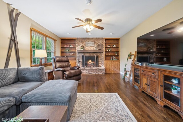 25 Lagoon Dr, Hawthorn Woods, IL 60047 - living room featuring a ceiling fan, wood finished floors, a fireplace, built in shelves, and baseboards