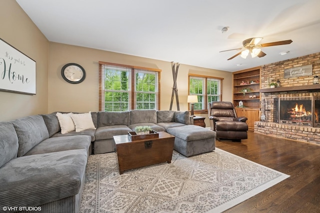 25 Lagoon Dr, Hawthorn Woods, IL 60047 - living area with ceiling fan, wood finished floors, a brick fireplace, and built in shelves