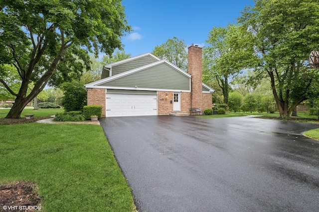 25 Lagoon Dr, Hawthorn Woods, IL 60047 - view of property exterior with asphalt driveway, brick siding, a chimney, a lawn, and a garage