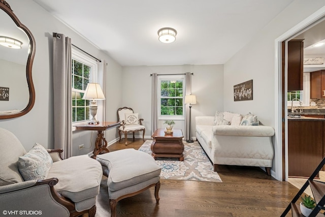 25 Lagoon Dr, Hawthorn Woods, IL 60047 - living room with healthy amount of natural light, dark wood-style flooring, and baseboards