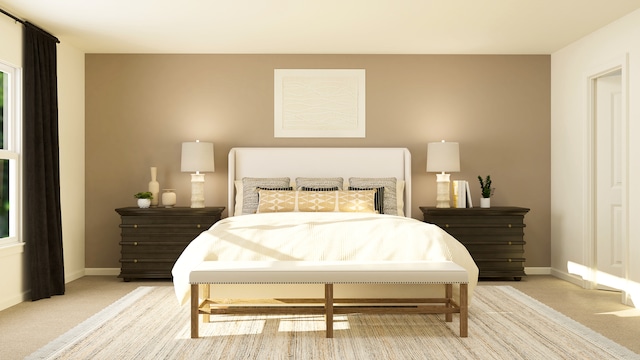 bedroom featuring light colored carpet and baseboards