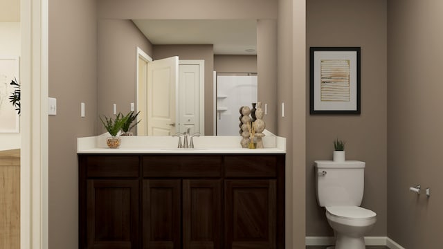 bathroom with toilet, baseboards, and vanity