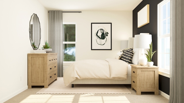bedroom featuring light colored carpet, multiple windows, and baseboards