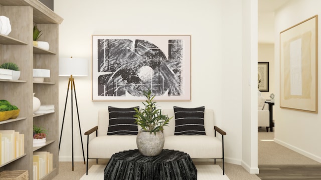 living area with carpet and baseboards