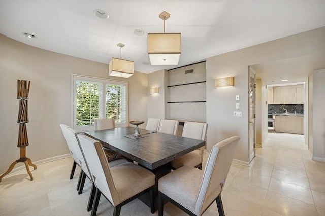 1700 2nd St Unit 509, Highland Park, IL 60035 - dining area featuring baseboards, light tile patterned flooring, and recessed lighting