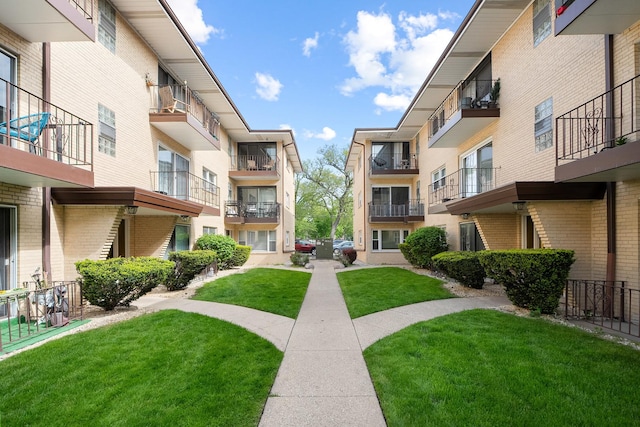 view of home's community with a lawn
