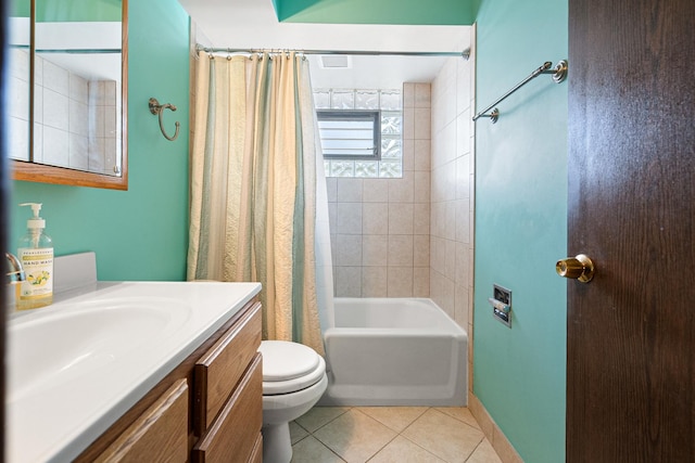 bathroom with tile patterned flooring, toilet, vanity, shower / bath combo, and baseboards