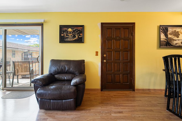 sitting room featuring wood finished floors and baseboards