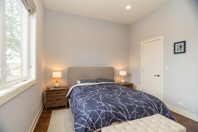 bedroom with wood finished floors, baseboards, and recessed lighting