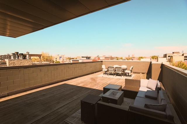 wooden terrace with outdoor lounge area and outdoor dining space