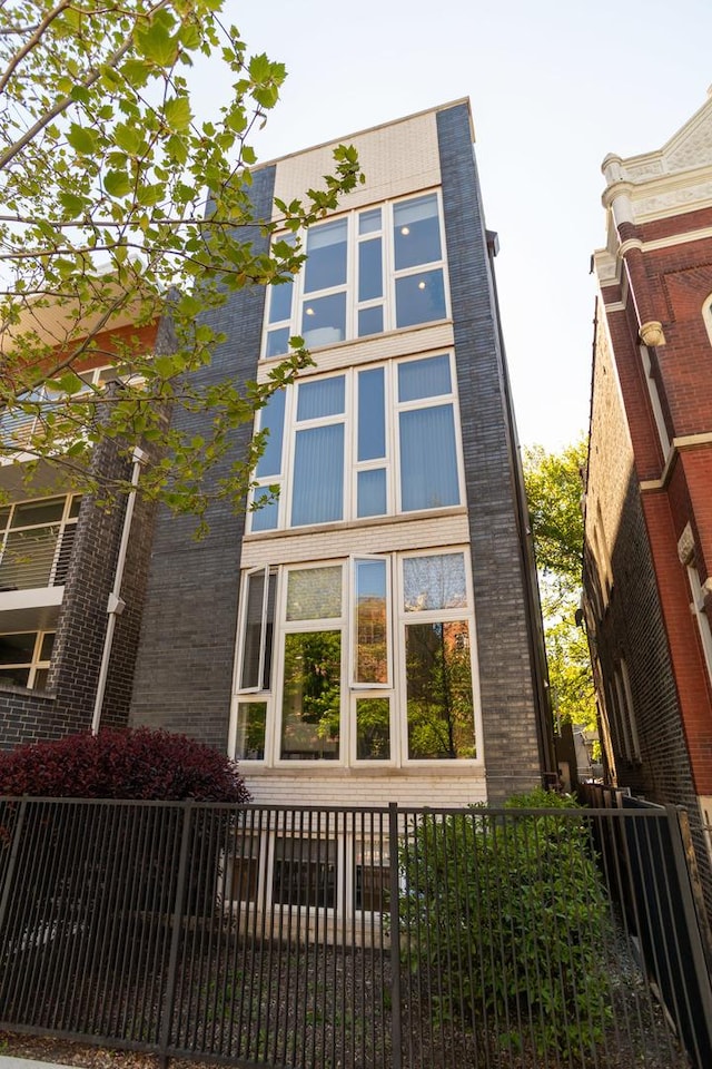 view of side of property featuring brick siding