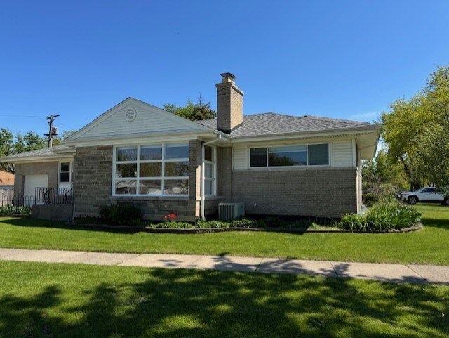 1841 Hawthorne Ave, Westchester, IL 60154 - ranch-style home with a chimney, a front lawn, brick siding, and a garage