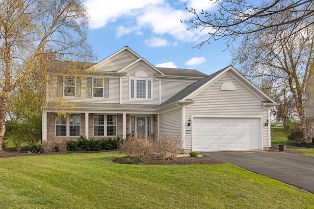 412 Baker Ct, Oswego, IL 60543 - traditional-style house featuring asphalt driveway, an attached garage, and a front lawn