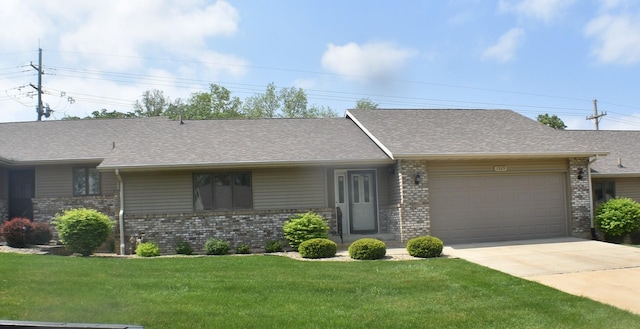 1925 W Mesa Dr Unit 1, Freeport, IL 61032 - single story home featuring brick siding, a garage, and driveway