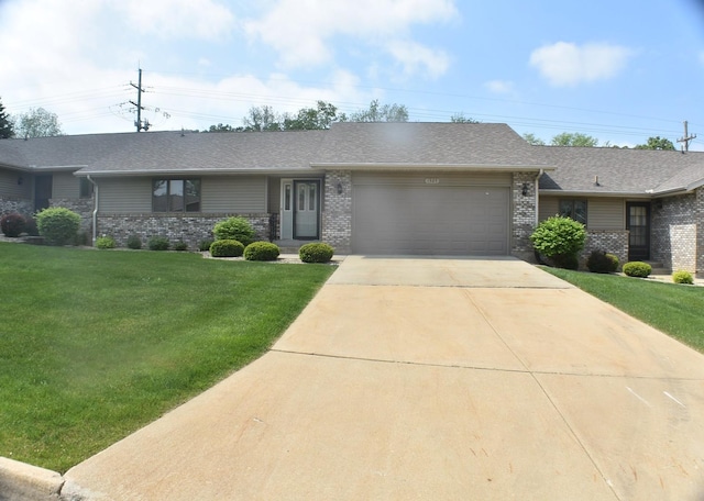 1925 W Mesa Dr Unit 1, Freeport, IL 61032 - view of front facade featuring a garage, brick siding, concrete driveway, a front yard, and a shingled roof