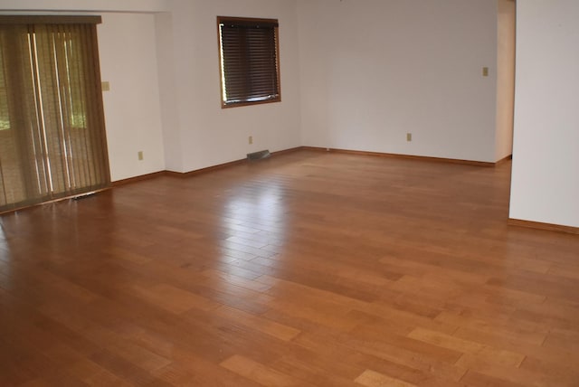1925 W Mesa Dr Unit 1, Freeport, IL 61032 - empty room with wood finished floors and baseboards
