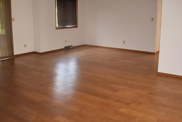 1925 W Mesa Dr Unit 1, Freeport, IL 61032 - spare room with wood finished floors and baseboards