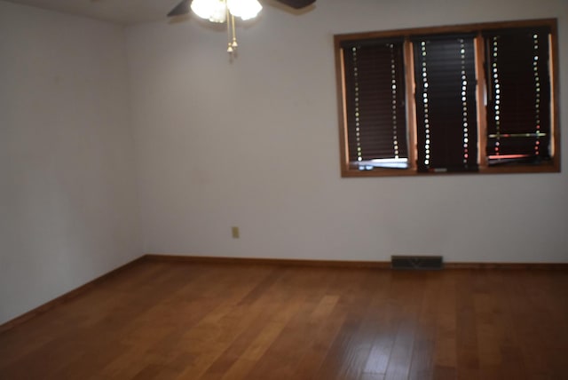 1925 W Mesa Dr Unit 1, Freeport, IL 61032 - unfurnished room featuring a ceiling fan, wood finished floors, and baseboards