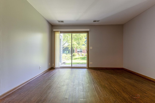 2442 Charleston Dr Unit 5, Schaumburg, IL 60193 - spare room featuring wood finished floors and baseboards