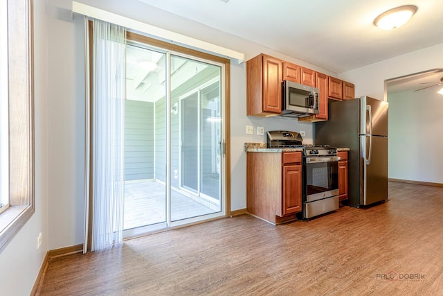 2442 Charleston Dr Unit 5, Schaumburg, IL 60193 - kitchen featuring appliances with stainless steel finishes, plenty of natural light, and light wood-type flooring