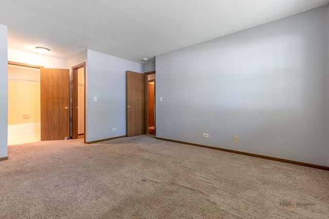 2442 Charleston Dr Unit 5, Schaumburg, IL 60193 - unfurnished bedroom with carpet flooring, baseboards, and ensuite bath