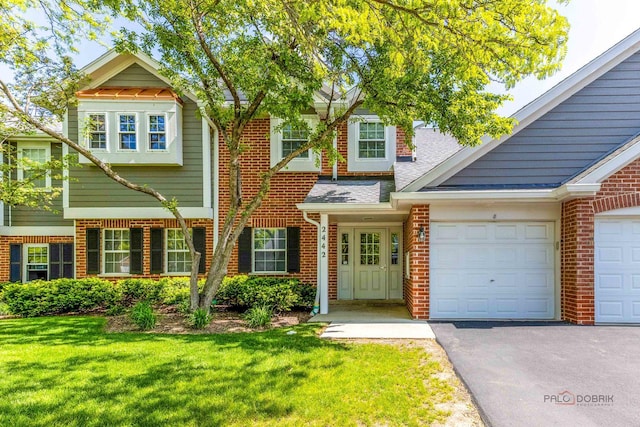 2442 Charleston Dr Unit 5, Schaumburg, IL 60193 - view of front of property with brick siding, driveway, and a front yard