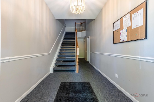 2442 Charleston Dr Unit 5, Schaumburg, IL 60193 - stairway featuring baseboards and a chandelier