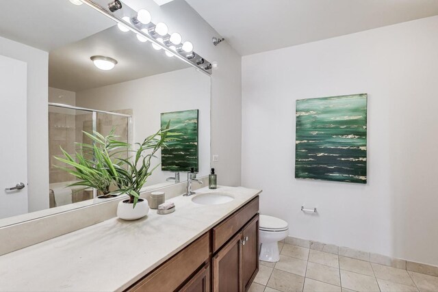 1160 S Michigan Ave Unit 1503, Chicago, IL 60605 - full bathroom with a stall shower, tile patterned flooring, toilet, vanity, and baseboards