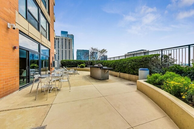 1160 S Michigan Ave Unit 1503, Chicago, IL 60605 - view of patio / terrace featuring fence and a city view