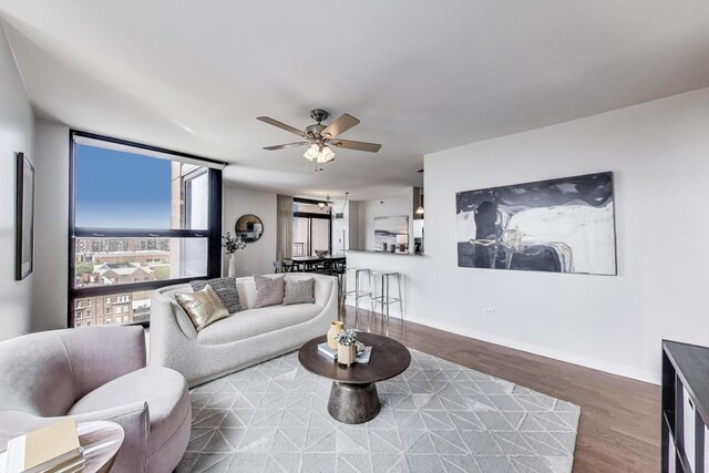 1160 S Michigan Ave Unit 1503, Chicago, IL 60605 - living area featuring ceiling fan, wood finished floors, and baseboards