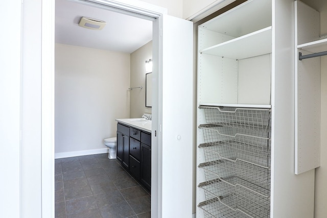 1600 S Prairie Ave Unit 810, Chicago, IL 60616 - full bathroom featuring vanity, toilet, baseboards, and tile patterned floors