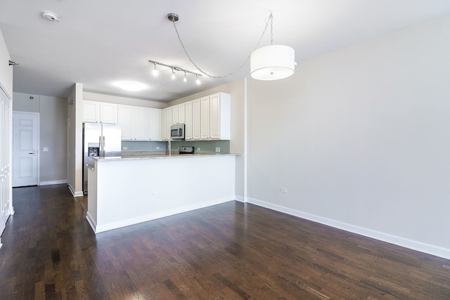 1600 S Prairie Ave Unit 810, Chicago, IL 60616 - kitchen featuring stainless steel appliances, white cabinets, baseboards, dark wood-type flooring, and a peninsula