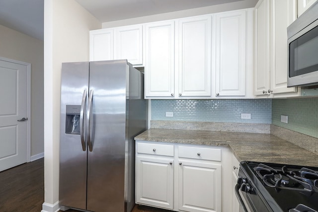 1600 S Prairie Ave Unit 810, Chicago, IL 60616 - kitchen featuring stainless steel appliances, tasteful backsplash, and white cabinetry