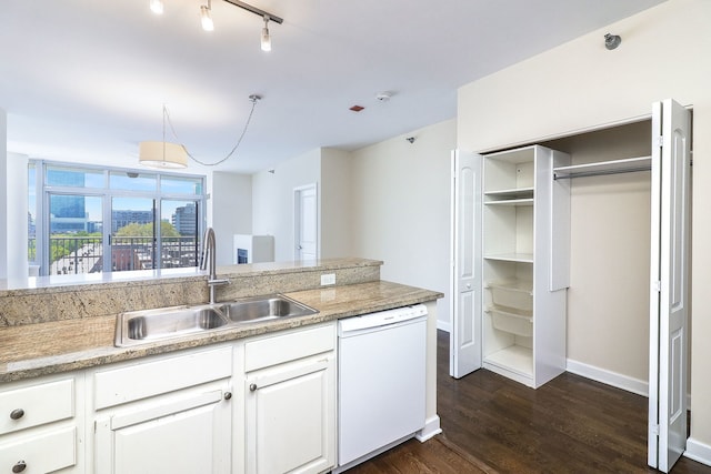 1600 S Prairie Ave Unit 810, Chicago, IL 60616 - kitchen with white dishwasher, a sink, dark wood-type flooring, white cabinets, and baseboards
