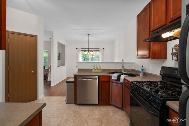 239 Nicole Dr Unit A, South Elgin, IL 60177 - kitchen featuring dishwasher, black gas range oven, a sink, a peninsula, and a chandelier