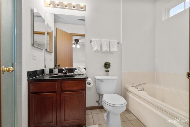 239 Nicole Dr Unit A, South Elgin, IL 60177 - full bathroom with toilet, a bath, vanity, a ceiling fan, and tile patterned floors