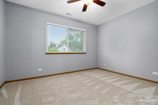 239 Nicole Dr Unit A, South Elgin, IL 60177 - spare room with a ceiling fan, carpet floors, and baseboards
